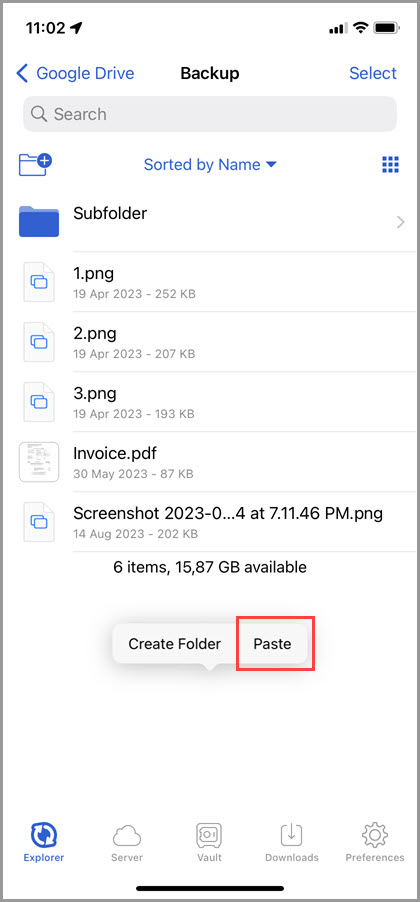 Screenshot of the 'Explorer' tab in GoodSync for iOS showing how to paste an item using a long-press